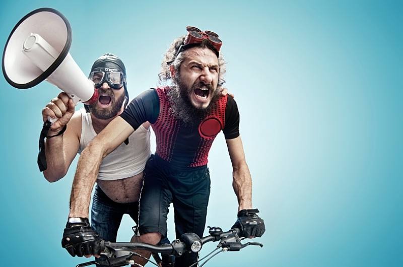 sweaty men on bicycle with loudspeaker
