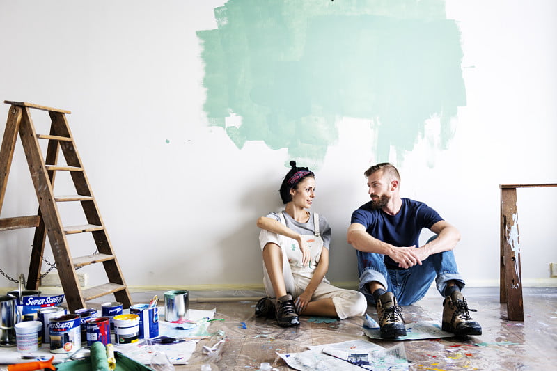 couple painting their first home