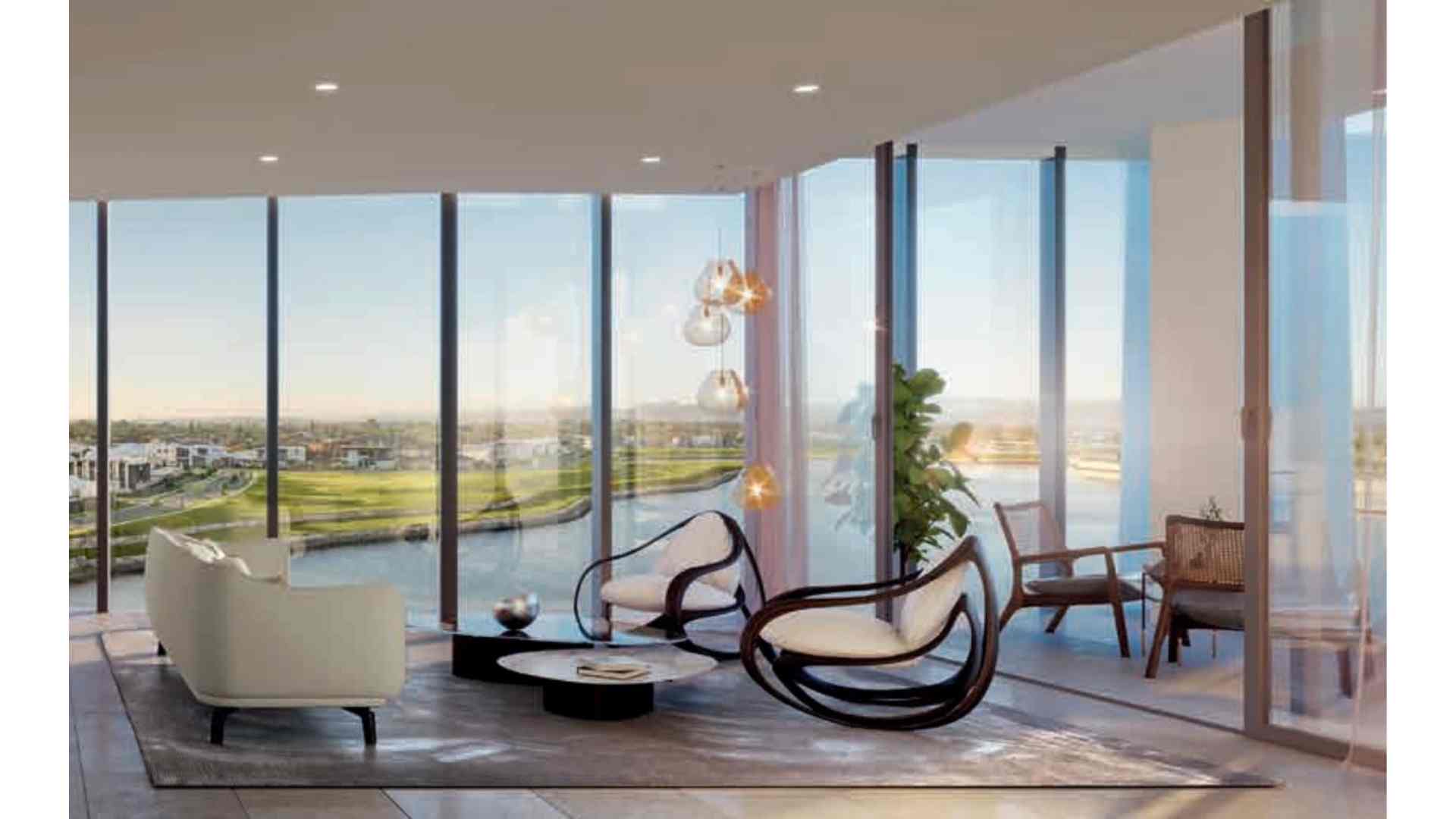 living area connected to balcony with view of the lake