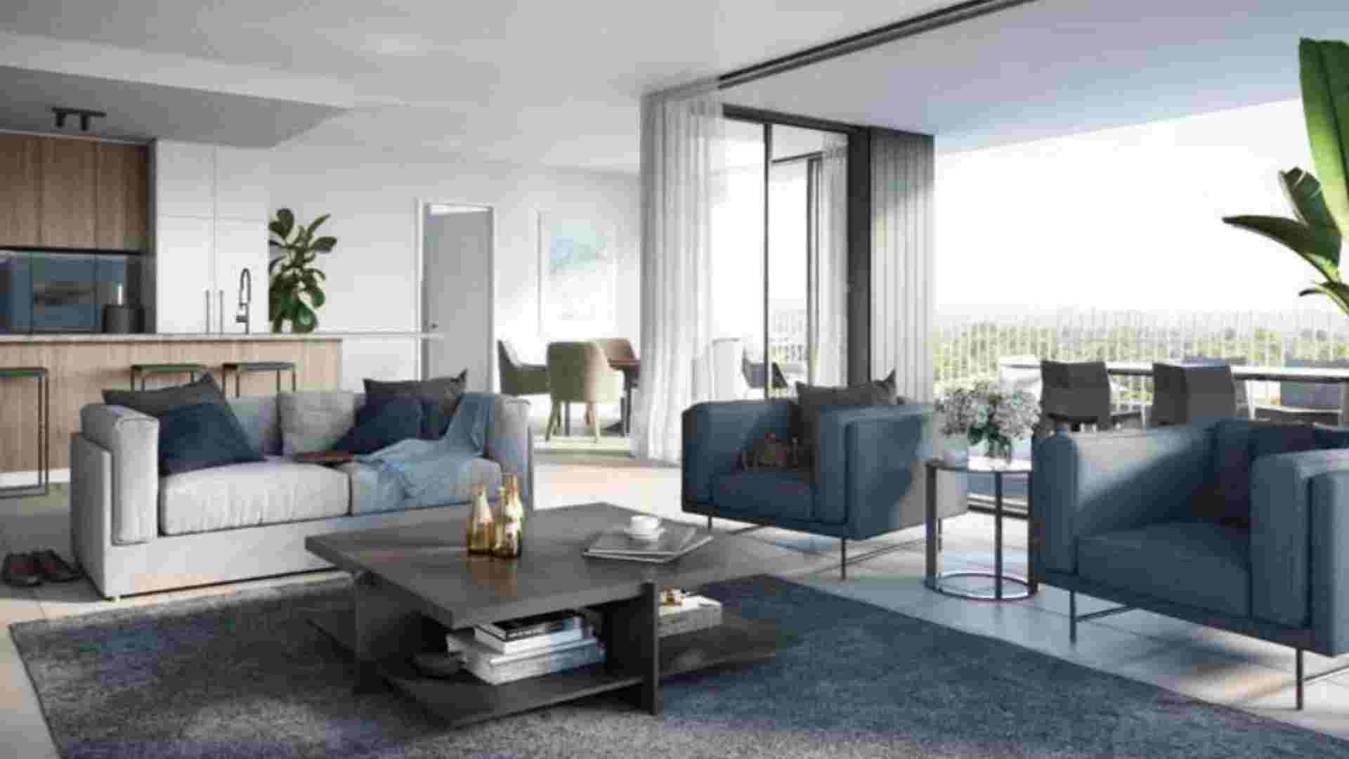 open plan apartment with balcony, navy blue and grey sofas