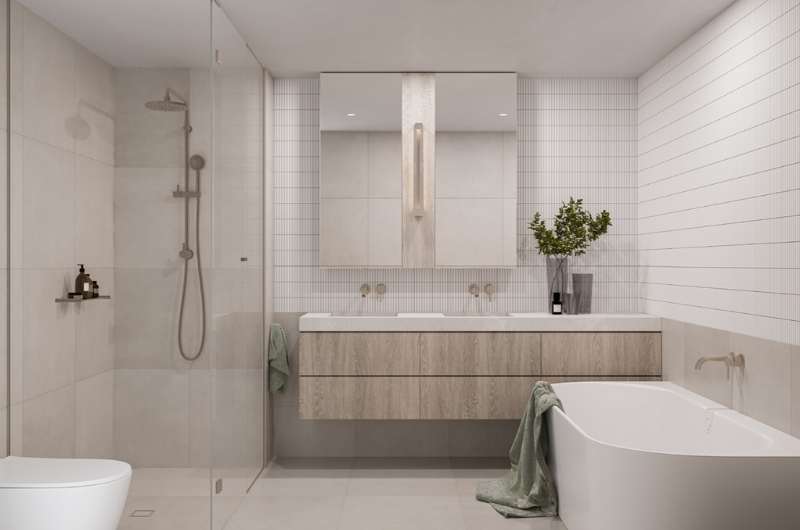 cream and white tile bathroom with wooden finish sink
