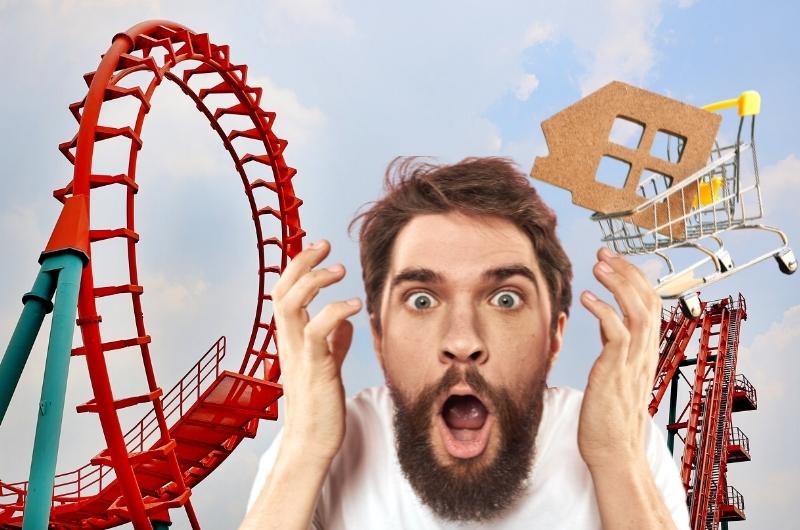 man looking shock looking at the roller coaster