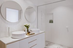 all white bathroom with white taps and mirrors