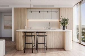 2 wooden stool bar in front of a white kitchen countertop