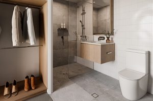 grey tiled bathroom next to a closet