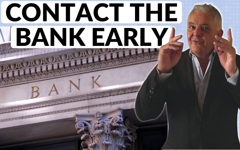 Andrew Unterweger pointing to the title with a picture of a bank next to him